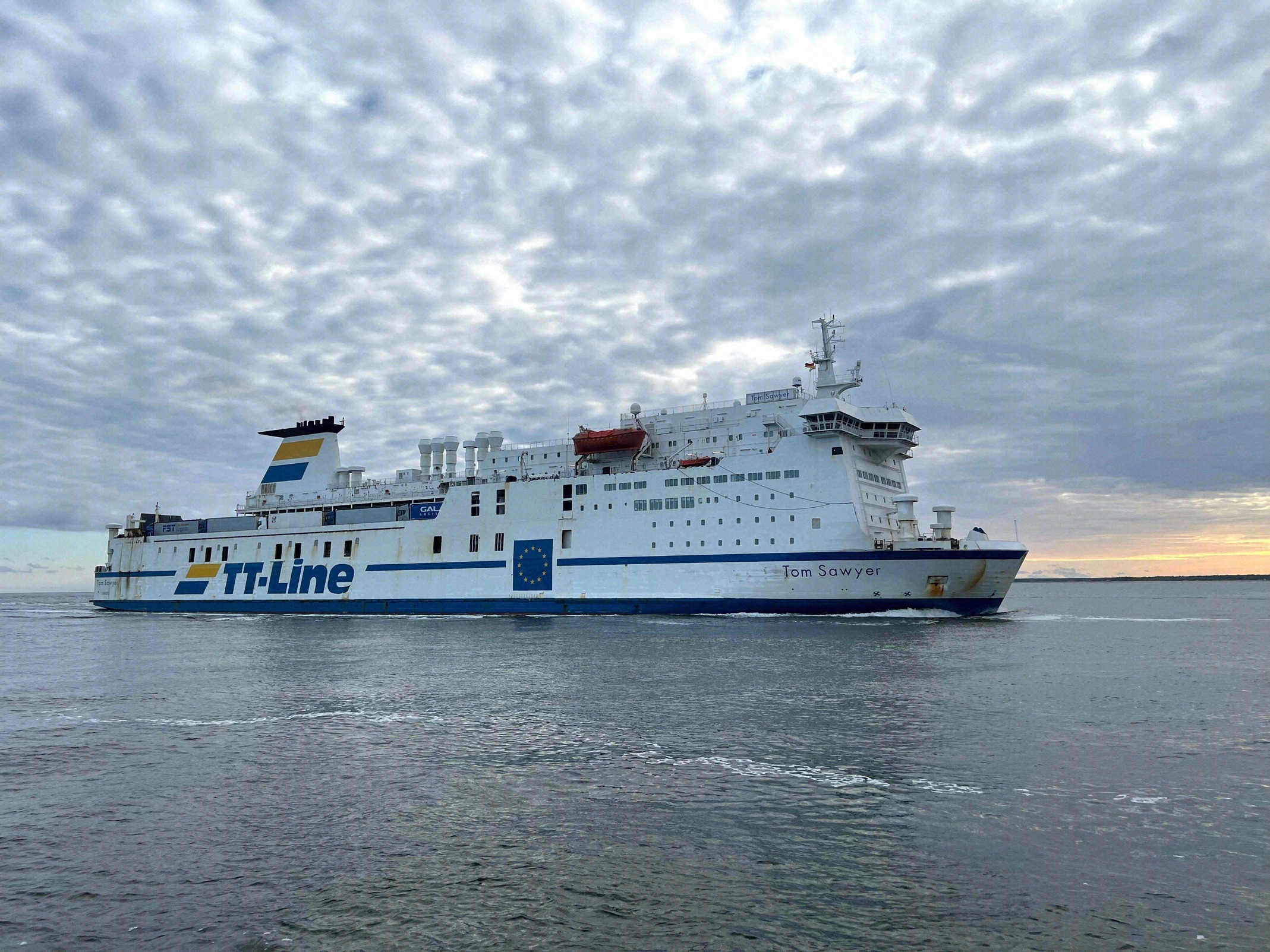 The TT-Line ferry Tom Sawyer leaves the port of Rostock bound for Trelleborg.